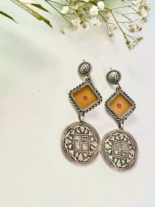 "Dhriti": Exotic and Exquisite dull orange earrings with striking versatile silver crafted hangings