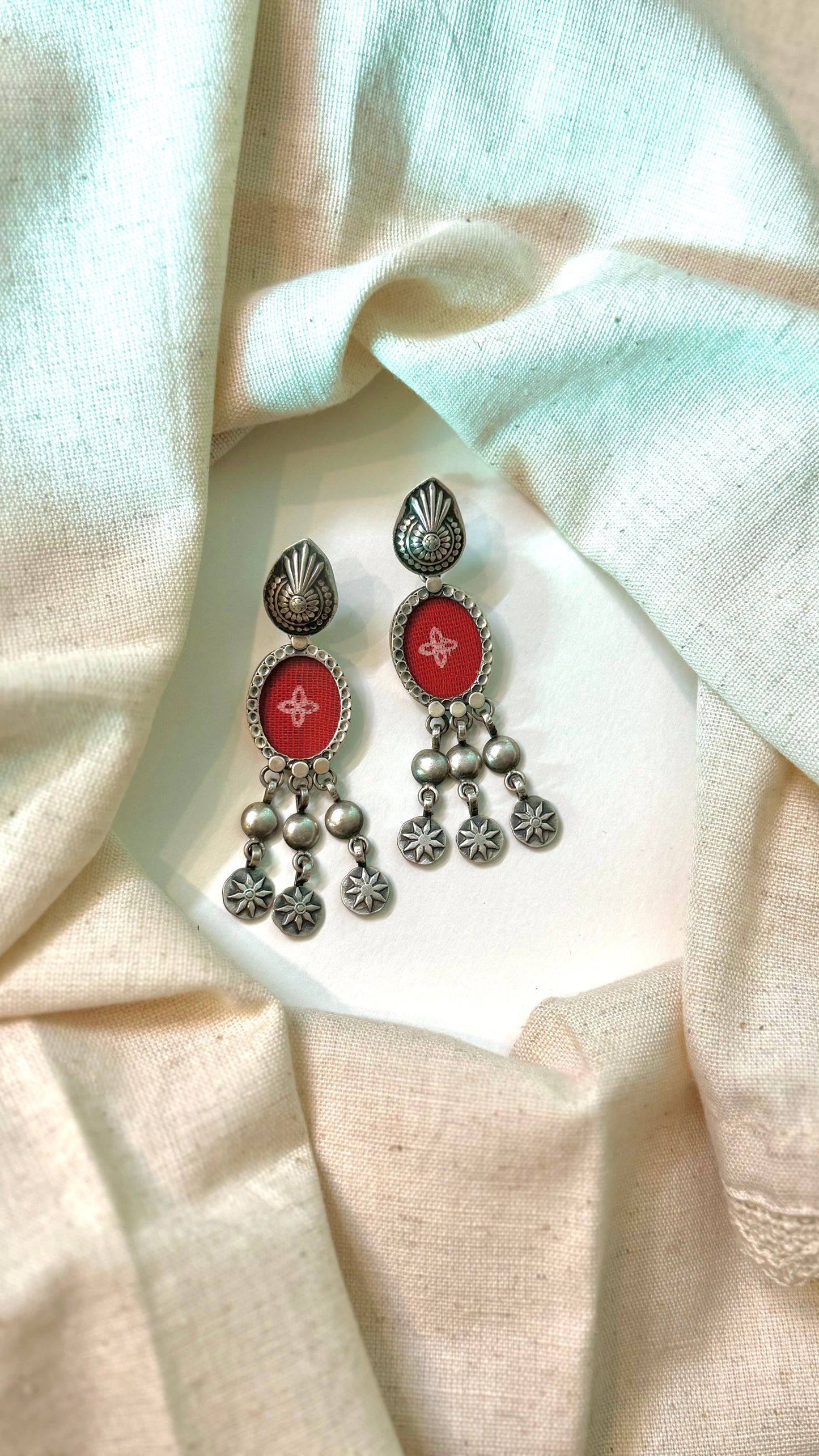 Fabric Fusion: Discover the charm of silver earrings with unique fabric-pressed designs