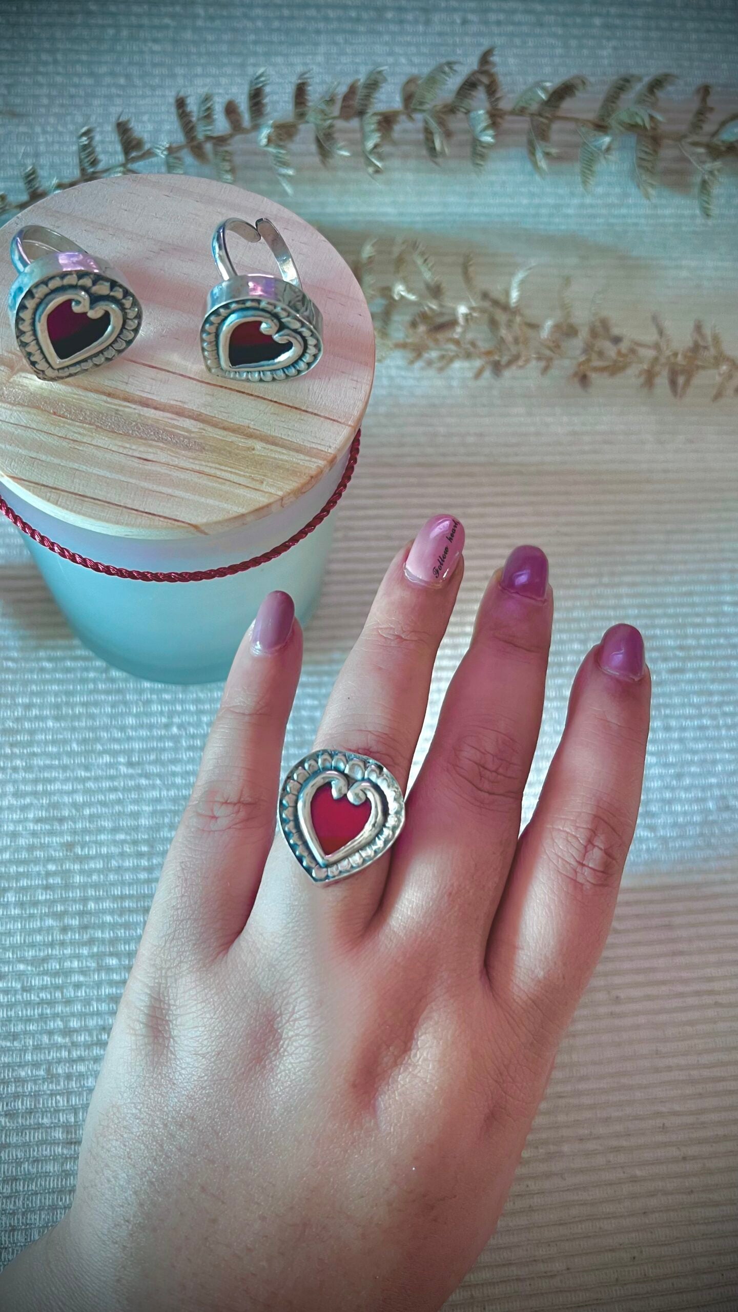 "EverHeart": (Burnt Red): Heart-shaped silver-crafted ring, a shimmering symbol of unbreakable bonds