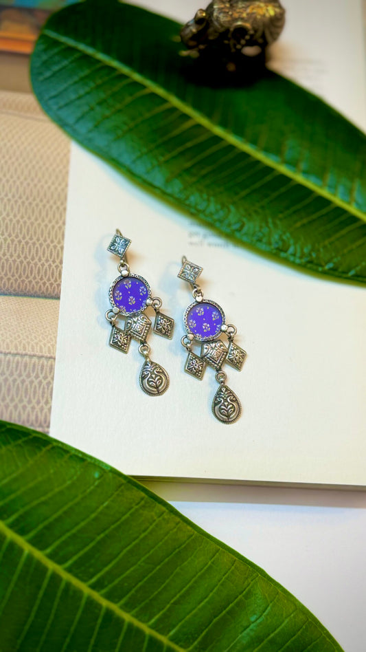 Suhani : Handpainted Silver blooms delicate, elegant earrings inspired by nature's beauty.