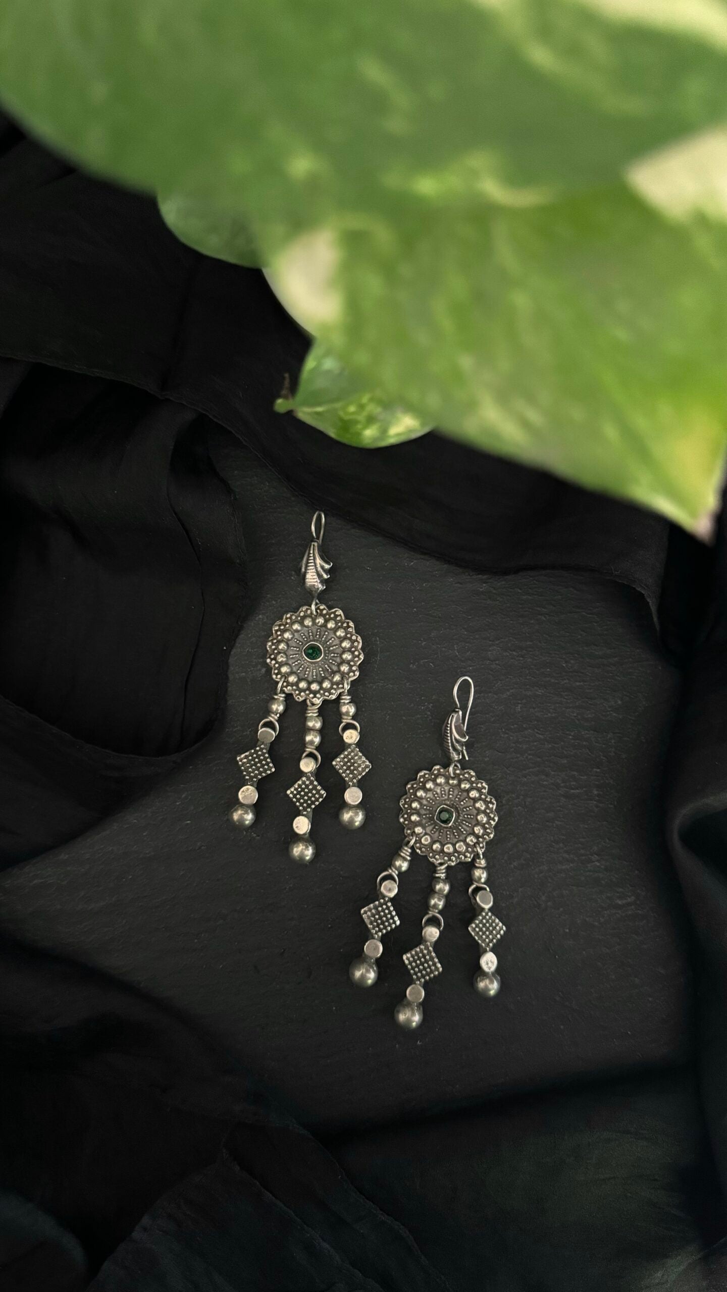 "Kalbeliya Knots": Each silver curve tells a story, as these vintage earrings capture the essence of a glamorous era.