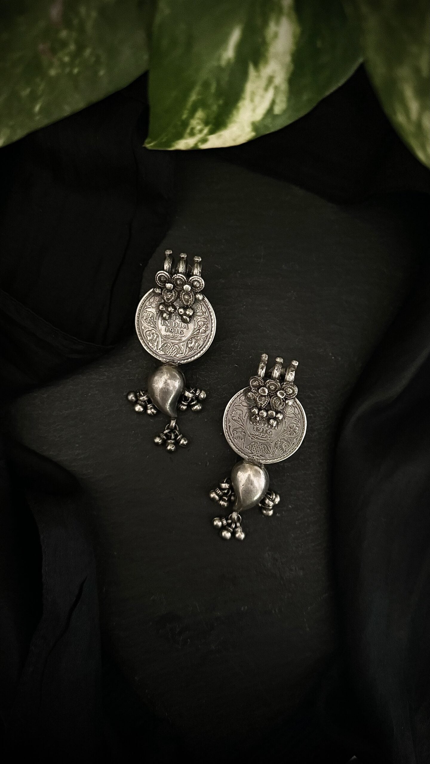 Cascading silver tales, these vintage earrings are an ode to the timeless beauty of a bygone era.