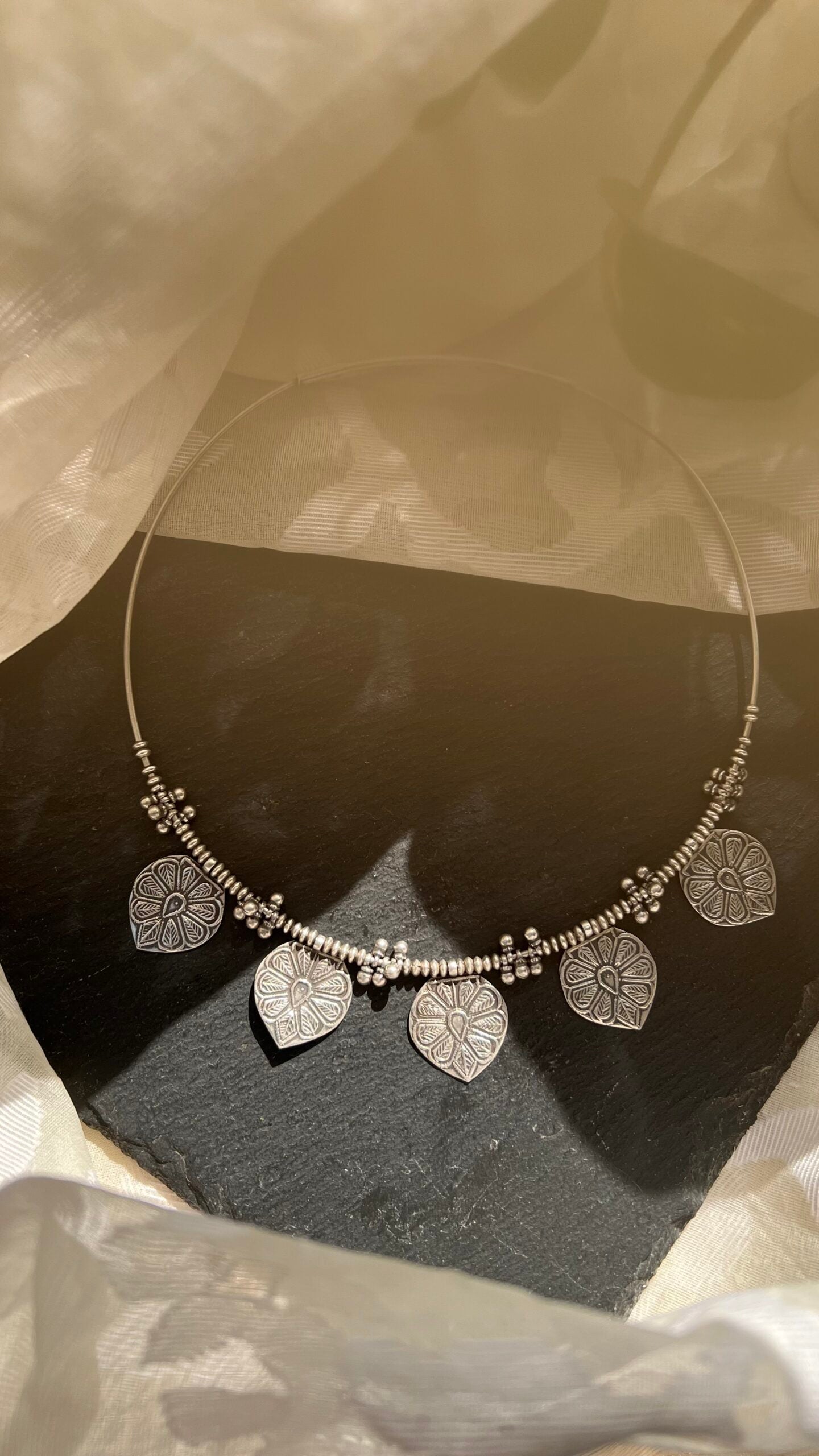 Rashida: Unveil the beauty of simplicity with a Silver hasli.