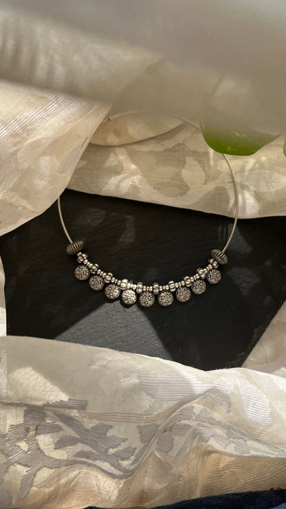 Ritika: Unveil the beauty of simplicity with a Silver hasli.